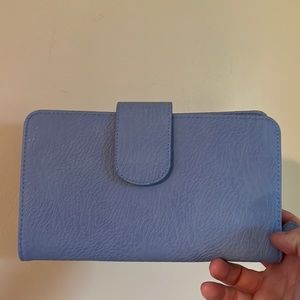 Periwinkle blue zippered clutch with snap closure